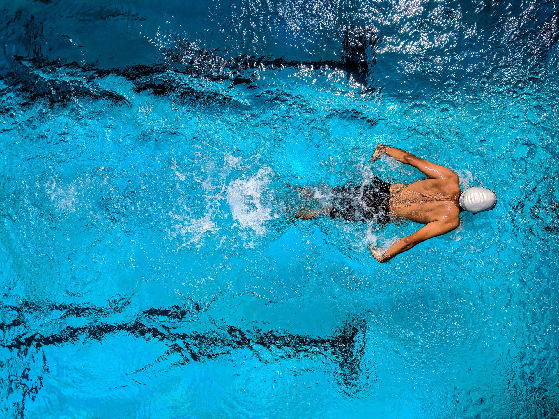 Top down view of a swimmer in a pool